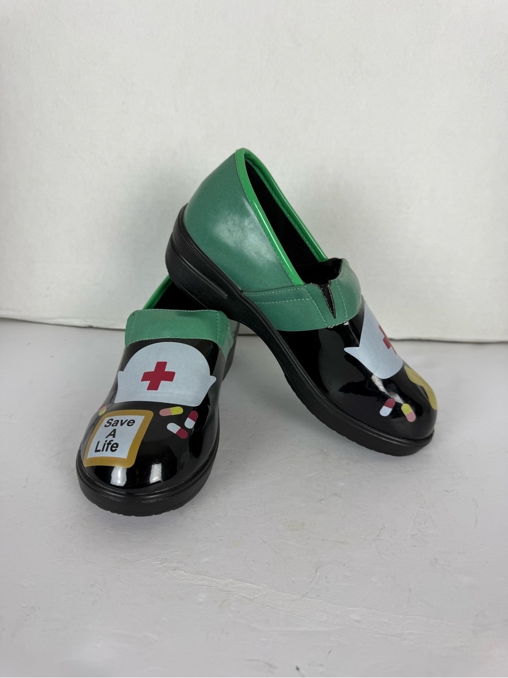 All Things Fabulous Green and Black Nurse-Themed Slip-On Sneakers
